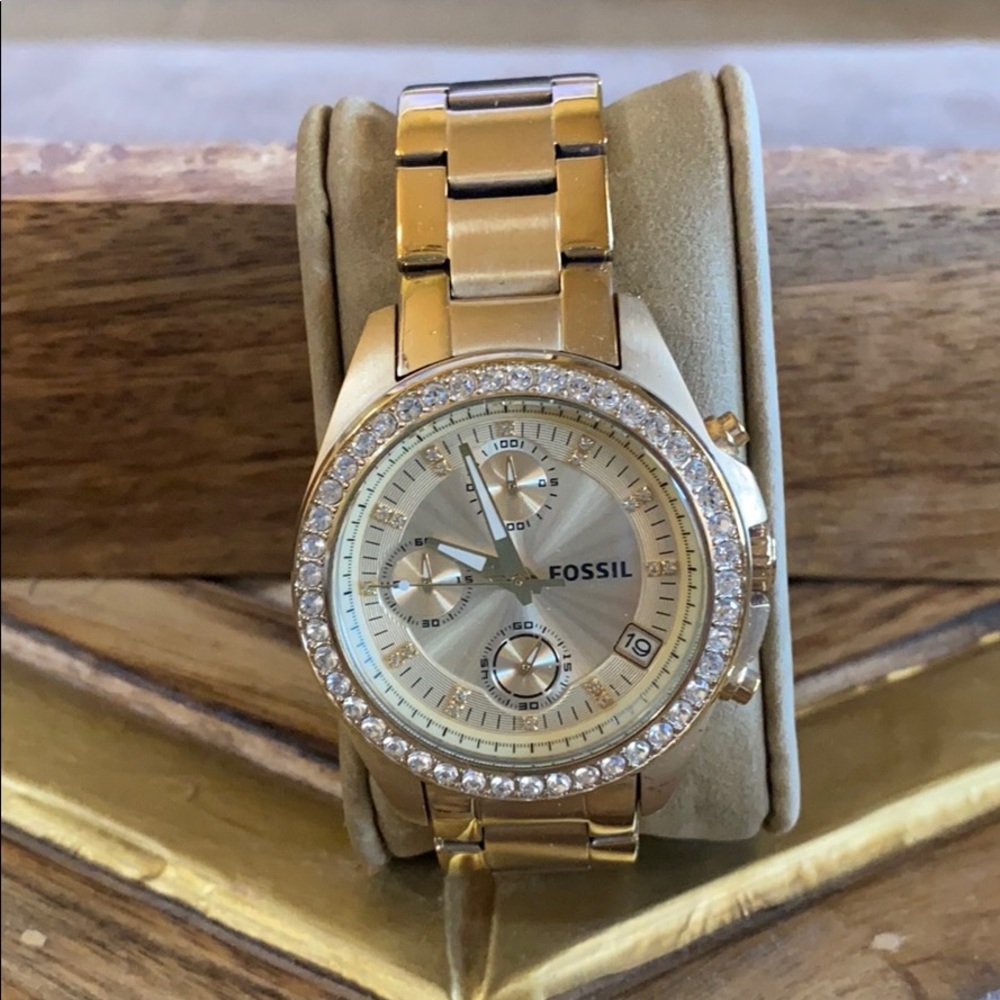 Gold Fossil watch with date. rhinestones on face